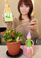 Japan's toy-maker e-Revolution employee displays a gadget "Hanakotoba" or "Communication Flower", in Tokyo on Wednesday. 