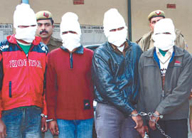 Four members of a gang of robbers arrested by the Delhi Police in the Capital on Wednesday. Tribune Photo