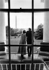 President and Mrs Gerald Ford wave to well-wishers from their private quarters on October 15, 1974, from the Truman Balcony at the White House in Washington DC.