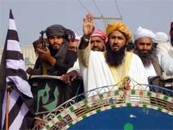 Leader of the Opposition Islamic alliance Muthidda Majlis-e-Amal (MMA), senator Khalid Soomro (C), leads an anti-government rally in Larkana, 480 km from Karachi on Wednesday. They demanded the scrapping of a Bill which President Pervez Musharraf signed into law curtailing the scope of Islamic laws on rape. Islamic Opposition leaders say it would turn conservative Pakistan into a free zex zone.