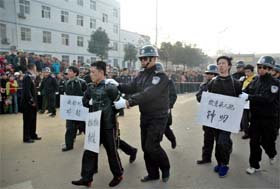 A group of convicted murderers are paraded in a public sentencing rally in Zhushou province in South Chinas Hunanprovince on Tuesday. Hundreds gathered to watch as seven men convicted of murder and robbery were paraded in a city street, before the men wee taken away and executed. The placards hanging around the mens necks describe their names and crimes they committed   AP