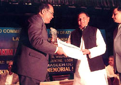 Delhi Health Minister Yoganand Shastri felicitating Dr Harish Burma for his research on Aulsar Rativ Kolaitis, at a function in the Capital on Wednesday evening.