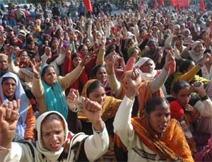 Activists of the Pendu Mazdoor Union hold a dharna in front of the Deputy Commissioners office in Jalandhar on Thursday.