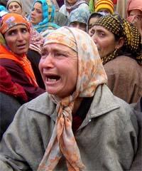 Relatives wail over the killing of a driver Mukhtar Ahamed in cross firing with militants and security forces in Shopian, south Kashmir in Srinagar