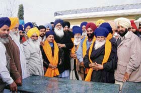 Former Chief Minister and president of SAD chief Parkash Singh Badal honours the Congress workers who had left the Congress party and joined the SAD ahead of the Assembly elections in the state, in Qadian