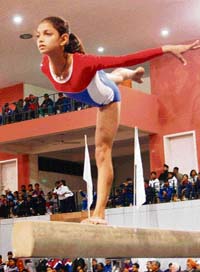 A gymnast performs during the championship at Shivalik Public School, Mohali, on Thursday.