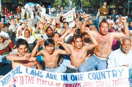 Family members of those killed in Punjab during the spate of terror in 1980s hold a demonstration demanding more relief from the government.   ATribune photograph.