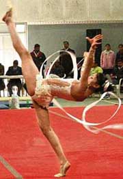 A gymnast displays her skills with ribbon in the National Gymnastic Championship at Shivalik Public School, Mohali, on Sunday.