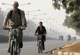 Two foreigners enjoy the last day of the year by cycling down the roads on bikes provided by CITCO in Chandigarh on Sunday.
