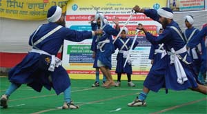 Gatka players show their art during a competition to mark Gurpurb of Guru Gobind Singh at Gurdwara Guru Tegh Bahadar Nagar in Jalandhar on Sunday.