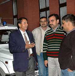 Members of the police team from Noida discuss a point with DSP Prem Singh Malik at the Sector 26 Police Station in Chandigarh on Monday