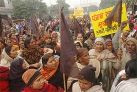 Safai workers take out a black-flag protest outside the residence of the Mayor demanding hike in wages in Jalandhar on Monday.