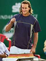 Argentinas David Nalbandian prepares to cut his birthday cake during the opening ceremony of the Chennai Open tennis tournament on Monday.