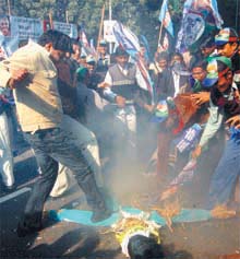 Activists of Lok Janshakti Party burning the effigy of American President George W Bush in protest against the execution of Saddam Hussain, at Parliament Street in the Capital.