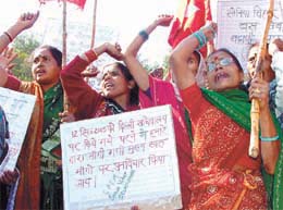Residents of Sonia Vihar demonstrating against Delhi Government for not carrying out development work in their area, at Raj Ghat in the Capital on Wednesday.