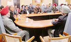 The Chief Justice of the Punjab and Haryana High Court listens to representatives of NGOs in Ludhiana