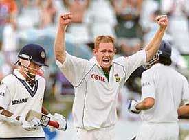 South Africas Shaun Pollock celebrates the wicket of Indias last batsman Sourav Ganguly on the second day of the third and final Test at Newlands in Cape Town on Wednesday