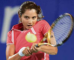 Sania Mirza plays a return to Anabel Medina Garrigues of Spain during their singles match at the Hopman Cup in Perth on Thursday. Garrigues won 3-6, 6-1, 6-3.  AFP photo