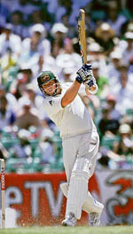 Australias Shane Warne hits a boundary during the third day of the fifth and final Ashes Test in Sydney on Thursday.  Reuters photo