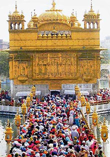 Devotees throng Harmandar Sahib in Amritsar to pay obeisance on the birth anniversary of the Tenth Sikh Guru on Friday.