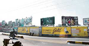 Commercial hoardings at important crossings pose a threat to motorists in Abohar.