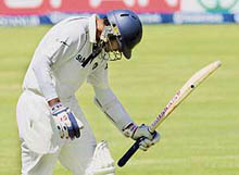 Rahul Dravid walks back to the pavilion after being dismissed by South Africas Paul Harris on the fourth day of the third Test at Cape Town on Friday. 
