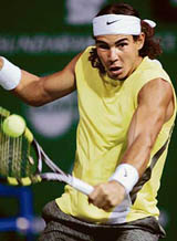 Spains Rafael Nadal in action against his Italian opponent Davide Sanguinetti during their quarterfinal in the Chennai Open on Friday.  Nadal won 6-3, 6-2. 