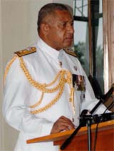 Fijis military commander Frank Bainimarama makes a statement after being sworn in as interim Prime Minister in Suva on Friday
