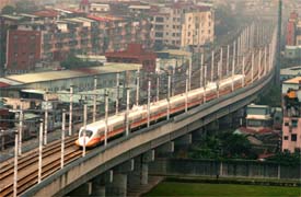 A Shinkansen-style high-speed bullet train passes through the city in Taipei on Friday.