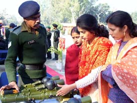 A jawan explains the use of an equipment to visitors at an exhibition organised by the Army in Pathankot on Saturday