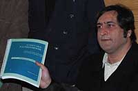 Peoples Conference chairman Sajad Gani Lone shows a copy of Achievable Nationhood, a vision document on the resolution of Jammu and Kashmir conflict in Srinagar on Saturday.