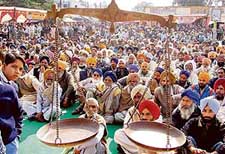 With the election symbol, Scales, in the foreground, SAD workers at the lalkaar rally in Dera Bassi on Saturday.