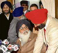 Mr Gurbachan Singh Babehali, who left the Congress to join the SAD, with SAD president Parkash Singh Badal on Saturday.