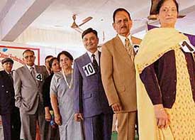 Senior citizens pose for a photograph during a fashion show held to mark the annual day of Senior Citizens Association at Parshuram Bhawan in Sector-37