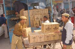 The police seizes cases of liquor from a house in Ghas Mandi in Jalandhar on Sunday