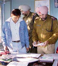 A team of the Railway Protection Force with Ajay Kumar, accused of selling railway tickets on the black market, in Chandigarh