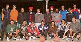 The state basketball boys team with officials before their departure to Jaipur to take part in the National Youth Basketball Championship, which begins on January 9