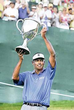 Fijis Vijay Singh holds the trophy after winning the Mercedes Benz Championship PGA Tour golf event in Kapalua, Hawaii