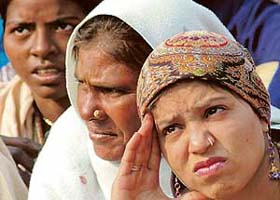 Domestic workers listen to talks about their rights on the occasion of World Domestic Workers’ Day in Chandigarh’s Sector 17