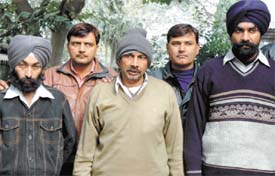uack doctor Ramkumar Yadav (C) with his close associates Harpreet Singh and Gurudeep Singh, being produced before the media, in the Capital.