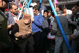 The Chief Minister of Himachal Pradesh, Mr Virbhadra Singh, being weighed against coins by the local people on his visit to Tamber in the Thural constituency in Kangra district on Tuesday.