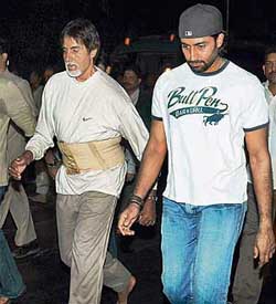 Superstar Amitabh Bachchan with son Abhishek arrives at Siddhivinayak temple for offering prayers in central Mumbai on Tuesday. They walked barefoot from their Juhu residence to the temple. 