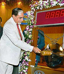Zee News Ltd. and Wire and Wireless India Ltd Chairman Subhash Chandra bangs the traditional bell on the occasion of listing of his company's shares at the Bombay Stock Exchange in Mumbai on Wednesday.