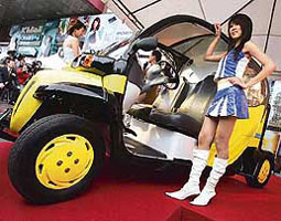 Models display Taiwan's Mingdao University's fourth-generation hydrogen-powered MHV4 car in Taipei on Wednesday.