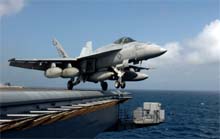 A handout picture released by the US navy shows an F/A-18E Super Hornet launching from the flight deck of the Nimitz-class aircraft carrier USS Dwight D.. Eisenhower at an undisclosed area. The US navy said the aircraft carrier had been deployed off the coast of Somalia as part of an operation "to monitor terrorist activities."