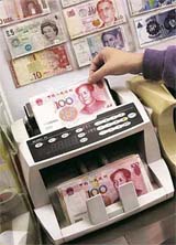 Yuan notes are counted at a currency exchange office in Hong Kong on Thursday.