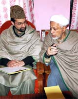 Chairman of the moderate faction of the Hurriyat Conference Mirwaiz Umar Farooq (left) discusses a point with Maulana Abbas Ansari in Srinagar on Thursday.