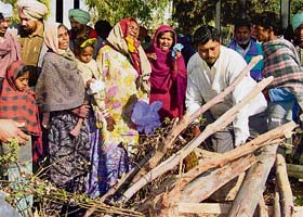 Parents wail over the dead at the cremation ground in Muktsar