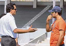Dilip Vengsarkar (left), Chairman of the Selection Committee, talks to Yuvraj Singh at the Brabourne Stadium in Mumbai
