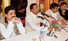 Deputy Chief Minister Chander Mohan is all ears as District Congress Pressident Om Prakash Devinagar (second from left), makes a point at a press conference in Panchkula on Saturday